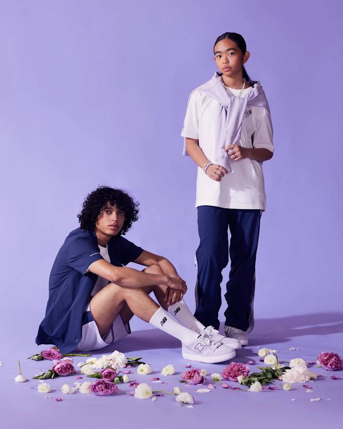 Models wearing blue and purple New Balance apparel.